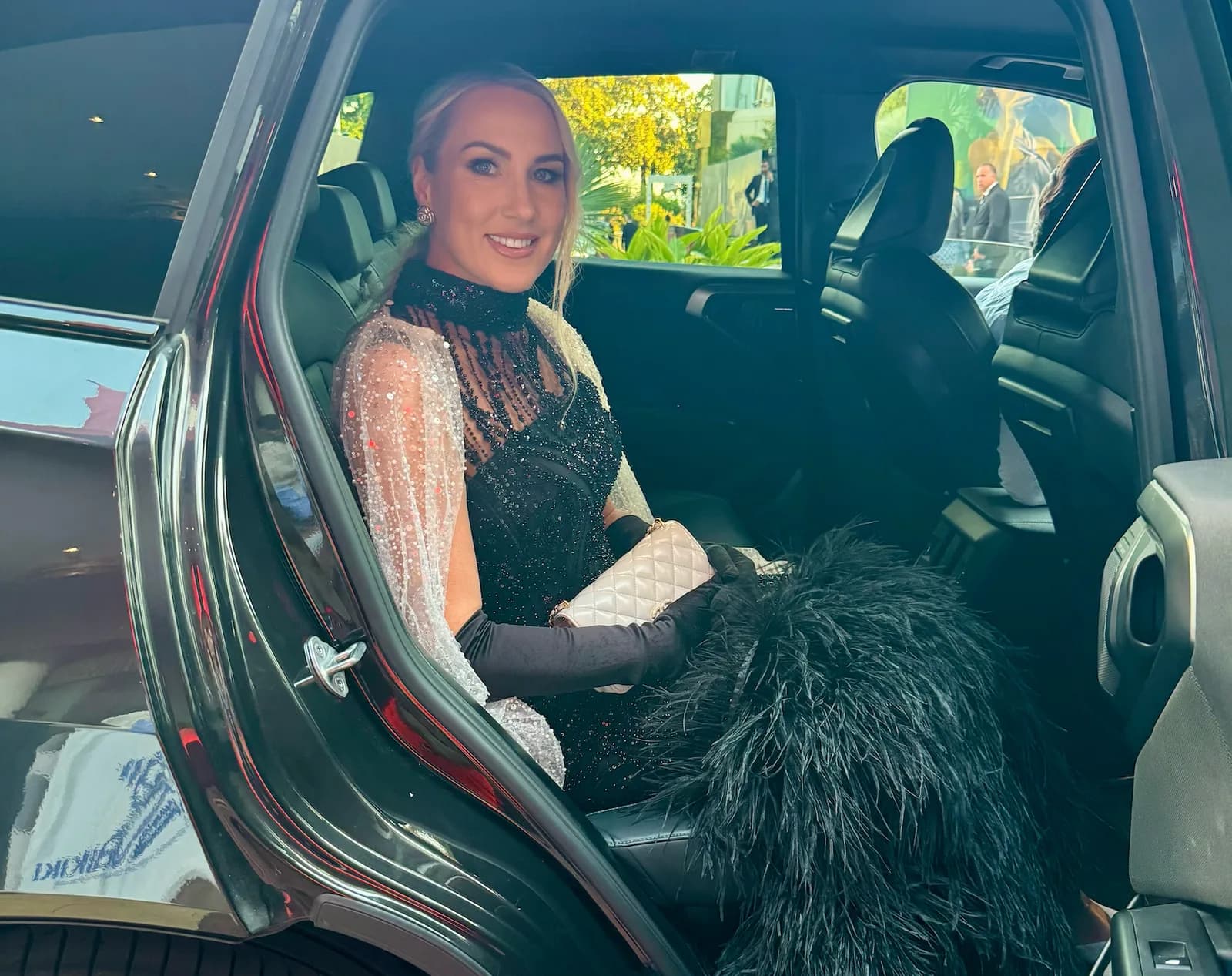 Alyona Iakymchuk in an evening gown arriving at a Cannes event by car