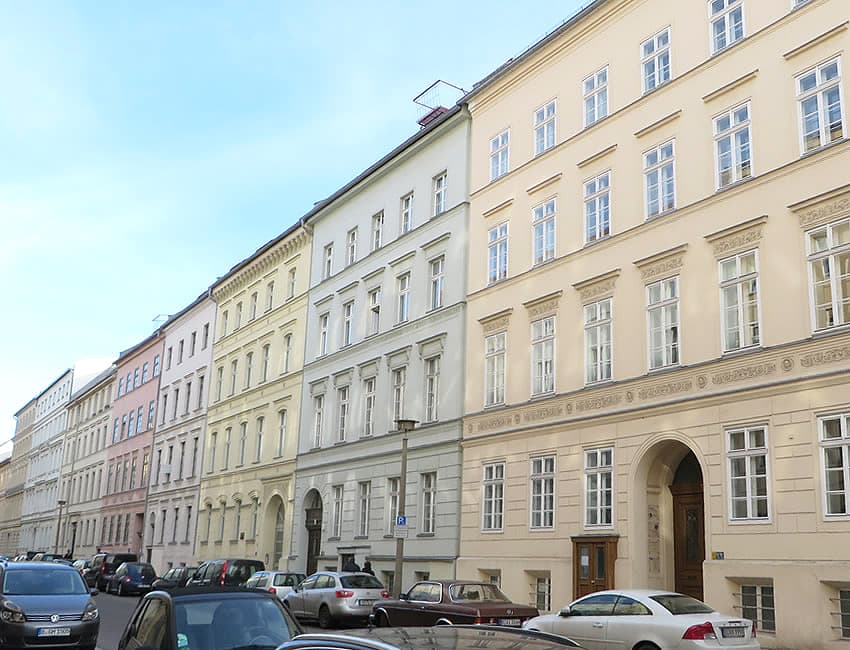 A row of classic apartment buildings on a Berlin street