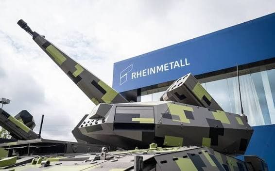 A Rheinmetall weapon system displayed in front of the company logo