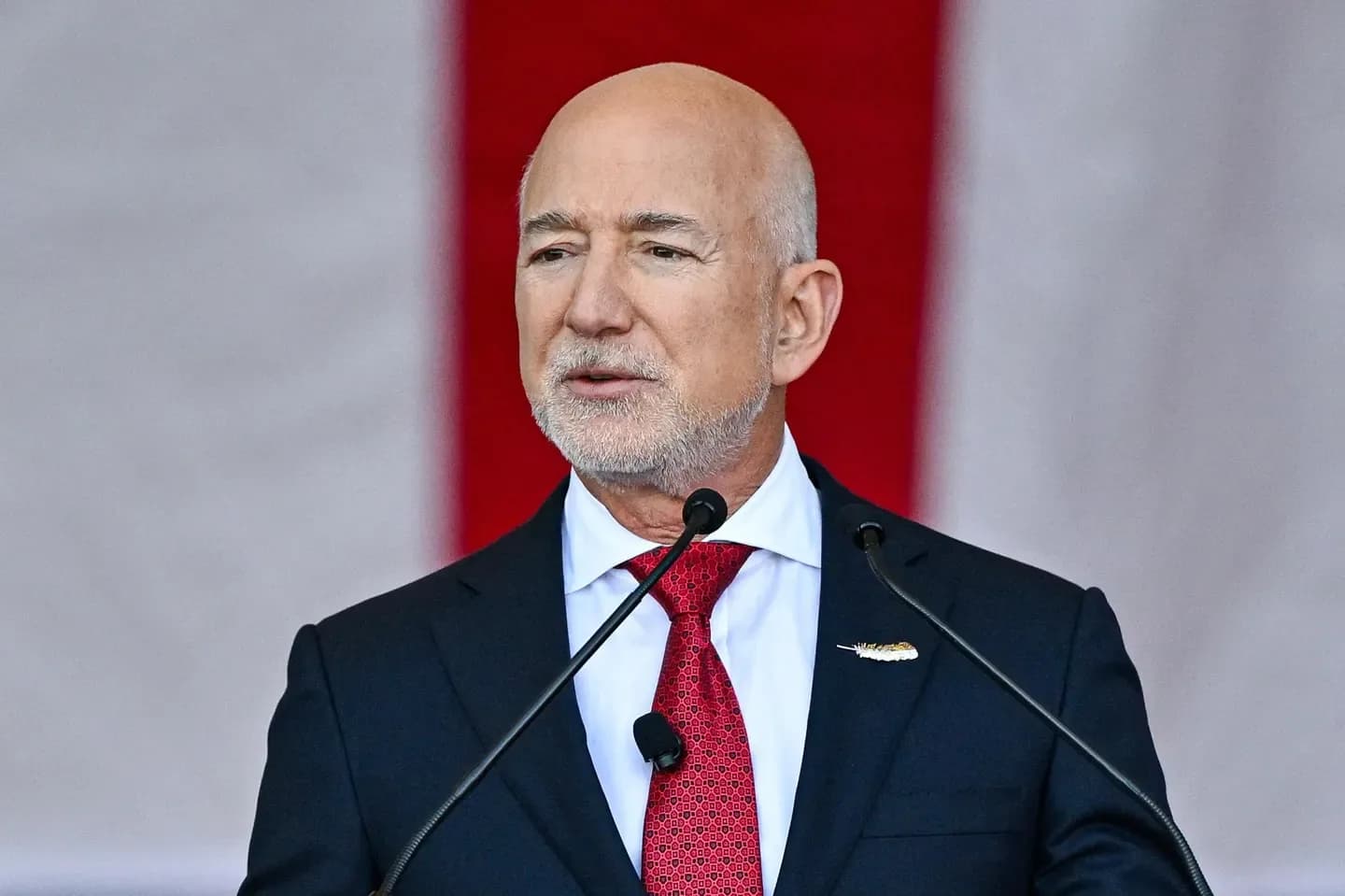 Jeff Bezos speaking at a podium