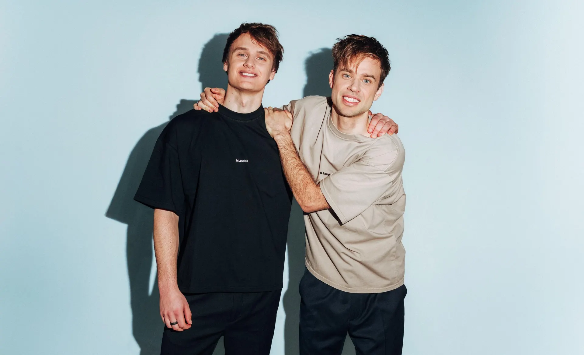 Lovable co founders Anton Osika and Fabian Hedin wearing Lovable branded shirts