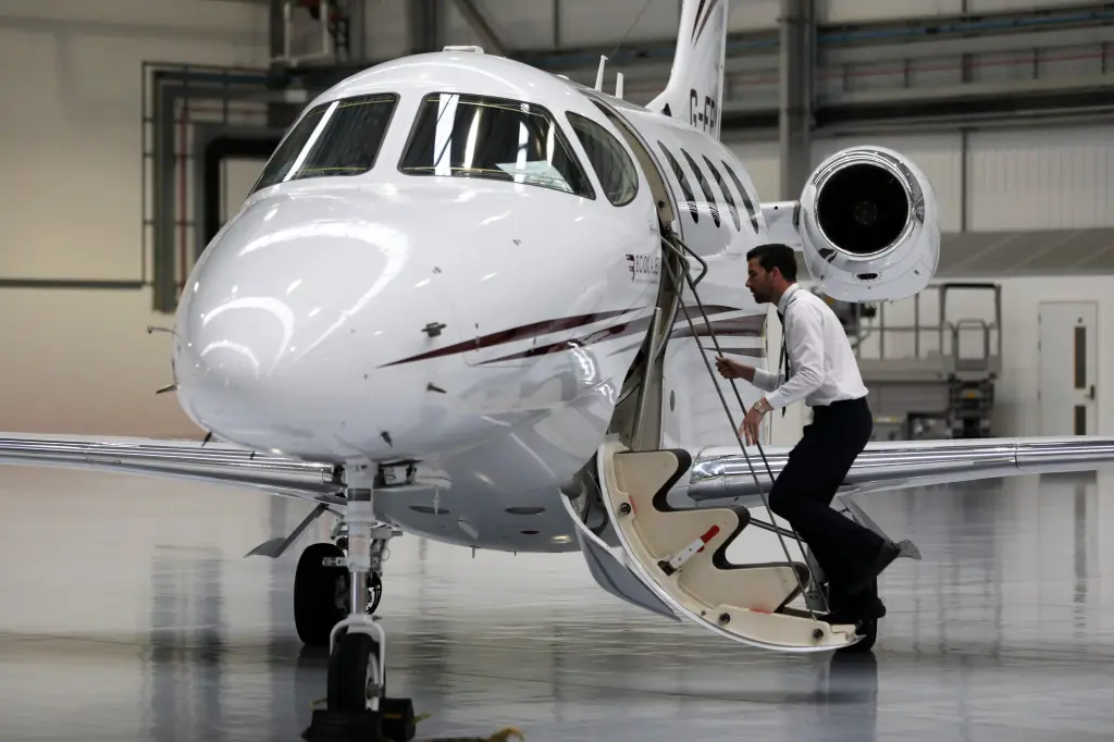A pilot boards a private jet