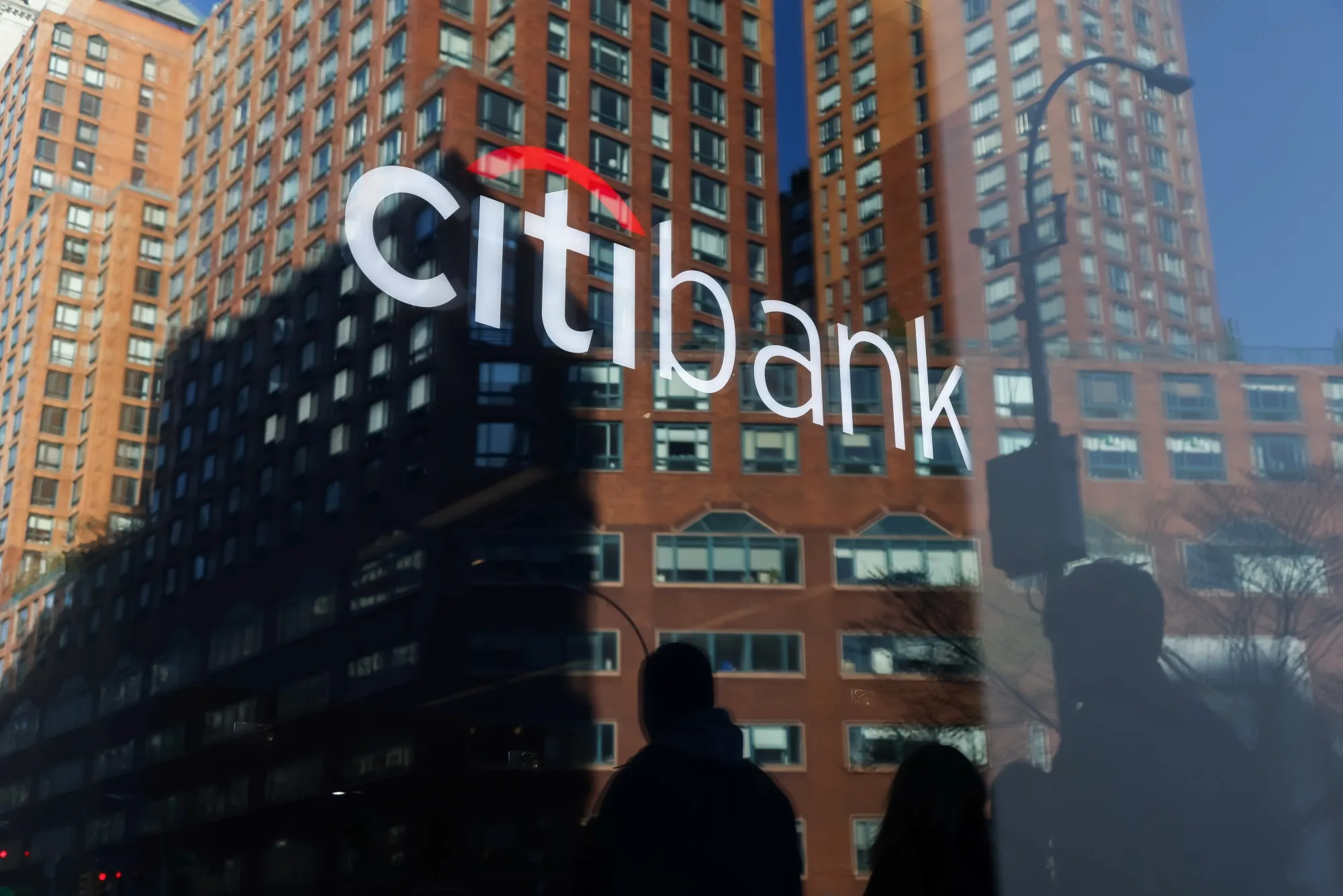 A Citibank sign reflected in a building window